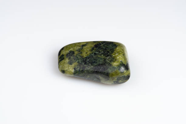 Natural stone green serpentine on a white background
