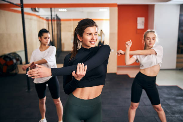 istock Three best female friends training at gym together 1306347500