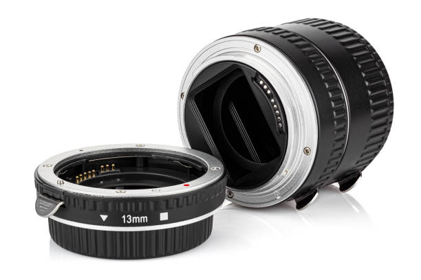 Lying three macro extension tubes for DSLR camera isolated on white background