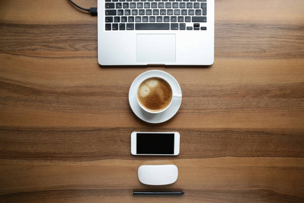 istock Directly Above Shot Of Communications concept drawing tablet, smartphone, computer, coffee 1306350455