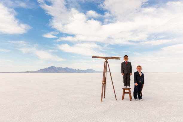 istock Two young Business Boys with Telescope 1306350803