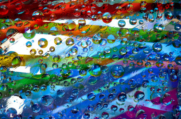 istock Tracery. Variegated spheres of different diameters are located on a rainbow background. 1306351663