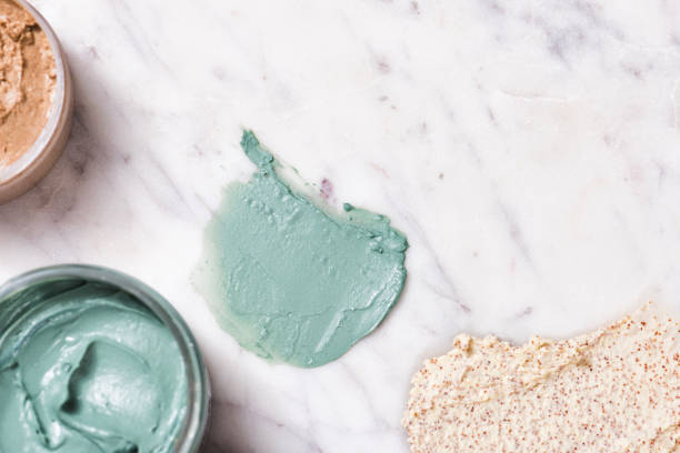 istock Natural spirulina face clay mask and scrub on marble 1306352067
