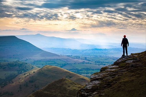 Hiker watching the sunset - Brecon Beacons national park, Wales
