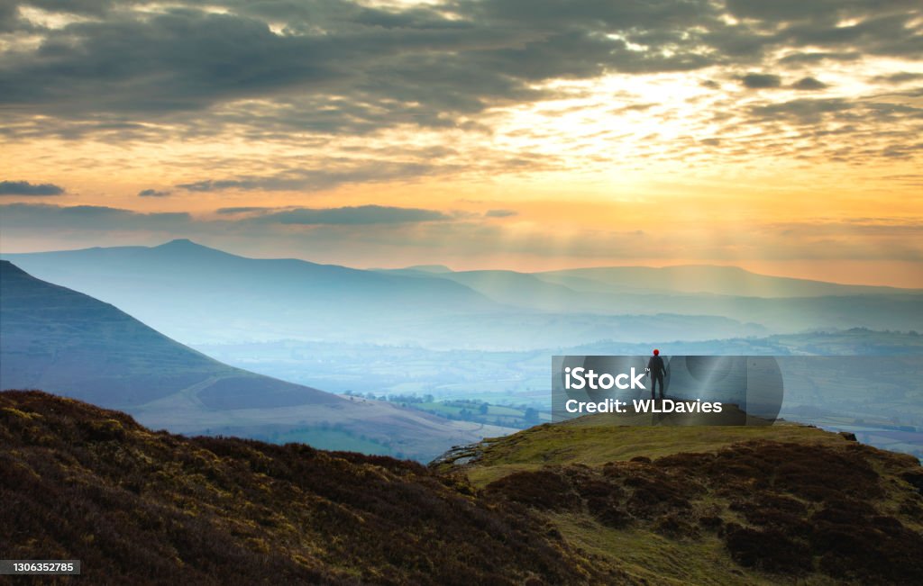 Wales landscape Distant figure against mountain sunset - Brecon Beacons national park, Wales Brecon Beacons Stock Photo