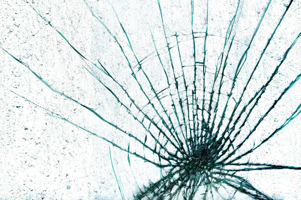 istock Cracks on a broken piece of glass 1306353077