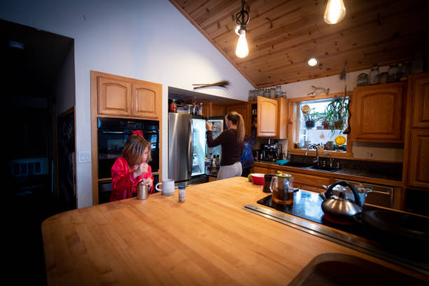 istock Single mother at home making breakfast with her children 1306354775