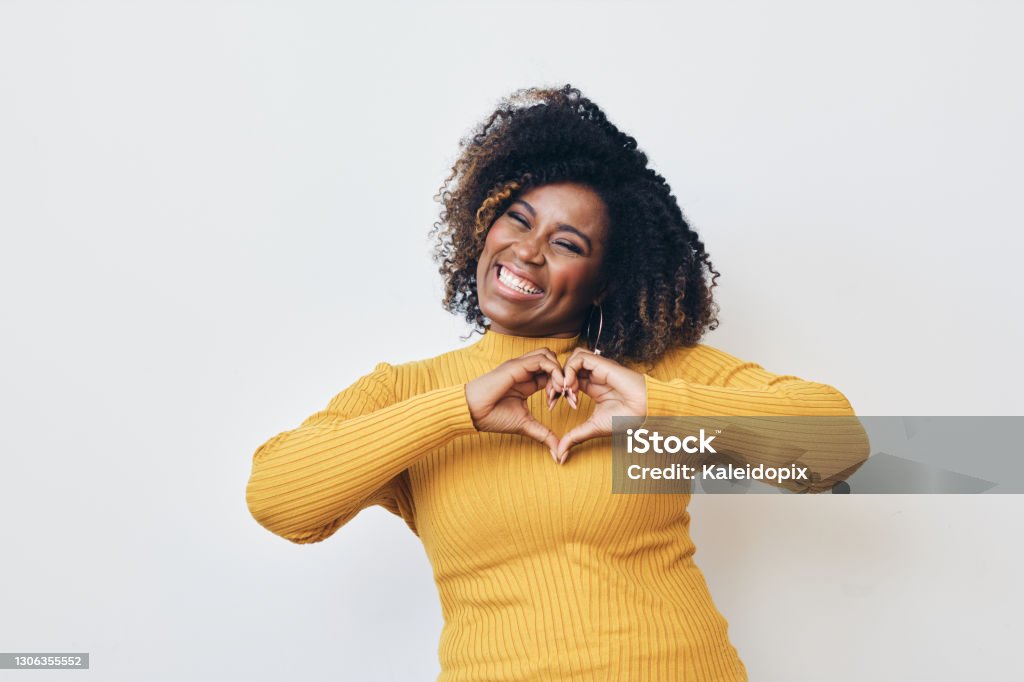 Happy African-American woman making heart with hands Happy African-American woman making heart with hands, smiling Happiness Stock Photo