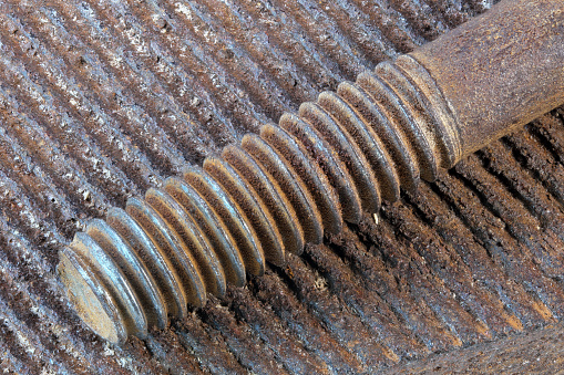 Artistic picture with rusty iron old bolt on the surface of a used file close-up macro photography