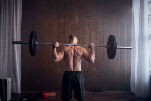 anonymous muscular athlete doing powerlifting exercises in the gym - shirtless energy action effort imagens e fotografias de stock