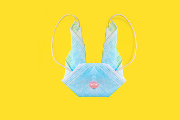 Origami Easter bunny with medical mask