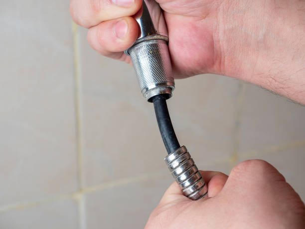istock Broken chrome shower hose in men's hands. Rift, rubber, selective focus, shower equipment 1306364775