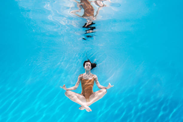 istock Athletic diver woman under water 1306364861