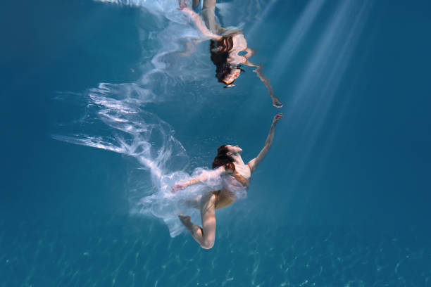 istock Athletic diver woman under water with plastic 1306365727