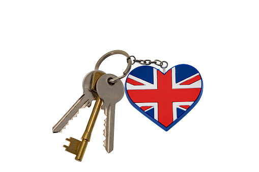 Three house keys with a heart shaped UK flag key fob  - white background
