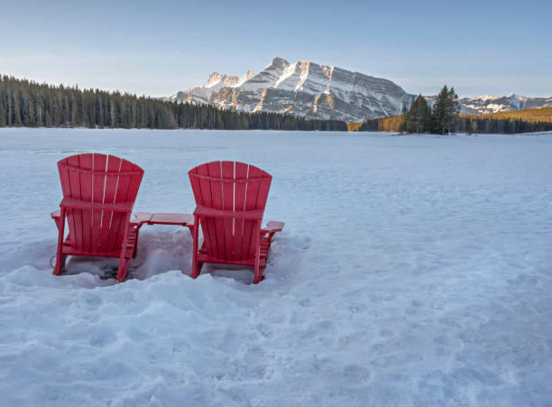 istock Red Chairs in Winter at Two Jack Lake 1306370016