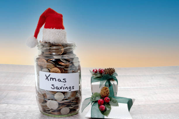 istock Glass jar of coins ready for Christmas 1306370091