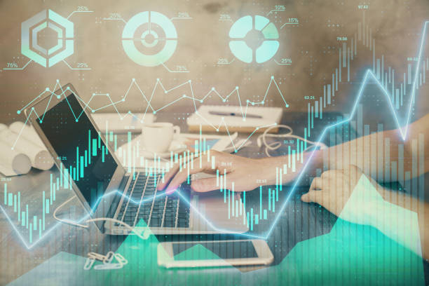 istock Double exposure of forex chart with man working on computer on background. Concept of market analysis. 1306370237