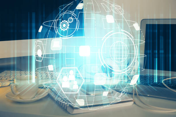istock Computer on desktop with social network theme icon. Multi exposure. Concept of international connections. 1306370373