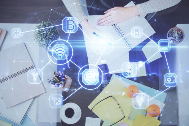 istock Social network theme hologram over hands taking notes background. Concept of global international people connect. Double exposure 1306371894