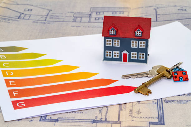 istock Energy efficiency ratings with a small house and door keys 1306372802
