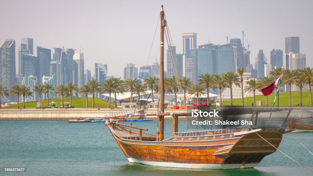 Qatar skyline along with traditional dhow. Qatar skyline along with traditional dhow.Selective focus Arabia Stock Photo