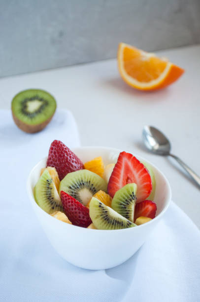 istock Fresh delicious fruit salad with strawberries and kiwi. 1306375017