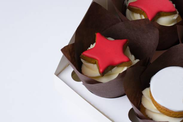 istock cupcakes with cream and red stars on a white background 1306375024