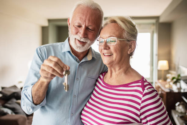 istock Senior couple with house key 1306378749