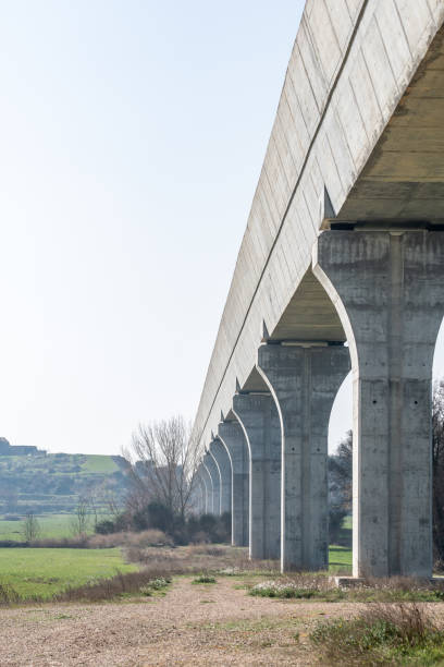 istock Bottom view of a modern aqueduct with its pillars. 1306378911