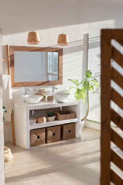 istock Stylish modern interior of a bright, sunny white bathroom 1306378971