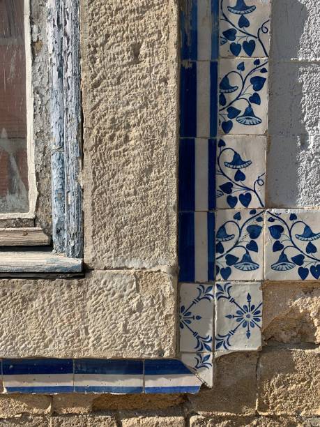 istock Damaged azulejos wall - window - wood painting - construction - architecture - stone 1306384668
