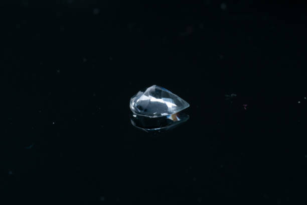 istock Natural stone blue topaz on a black background 1306385697