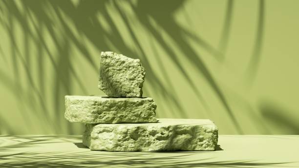 istock 3d render, abstract green background with tropical leaves shadow and bright sunlight. Minimal showcase scene with cobble stones pedestal for eco cosmetic product presentation 1306388618