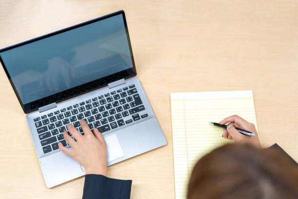 istock Unrecognizable Asian woman working in the office 1306394639