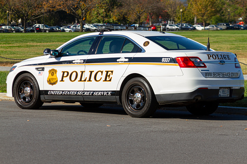 Washington DC, USA 11-06-2020: A Ford Police Interceptor car used by the Uniformed division of the United States Secret Service is parked in the Ellipse  in front of White House.