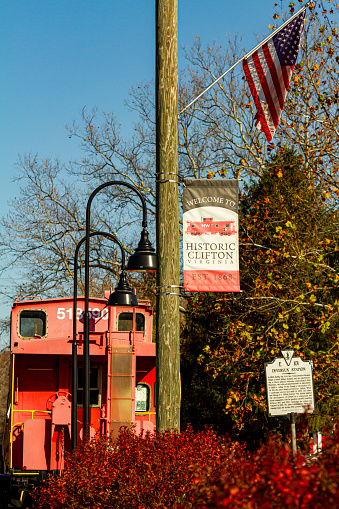 Passenger Train Approaching Station with People waiting to Board