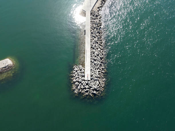 istock Aerial view of breakwater with concrete blocks 1306399290