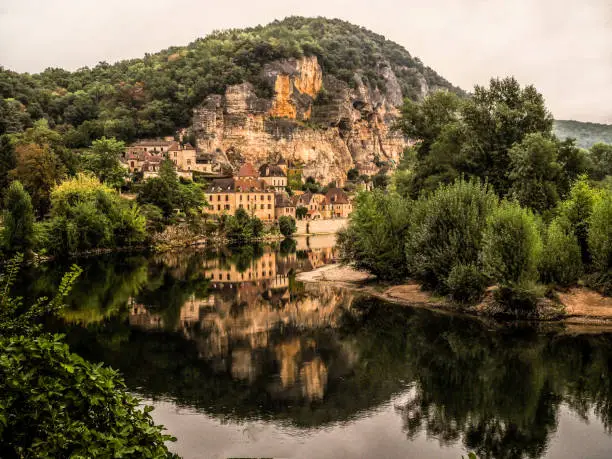 La Roque-Gageac reflecting on the Dordogne River in France