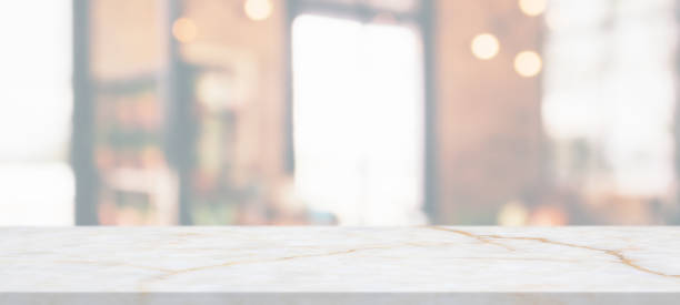 istock marble table top with blurred abstract cafe restaurant interior background 1306400455