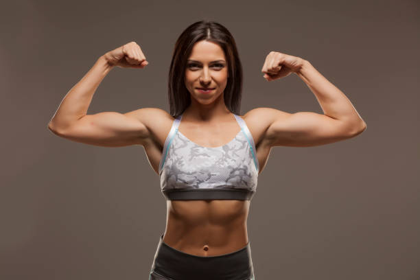istock Pretty muscular young woman 1306401110