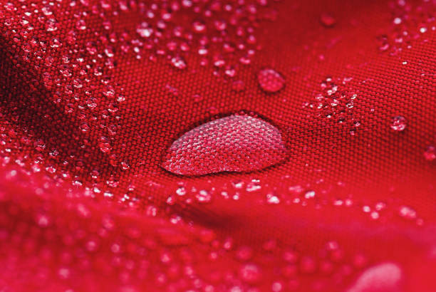 istock Large water drop on red waterproof fabric 1306405601
