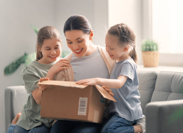 istock women are holding cardboard box 1306408682