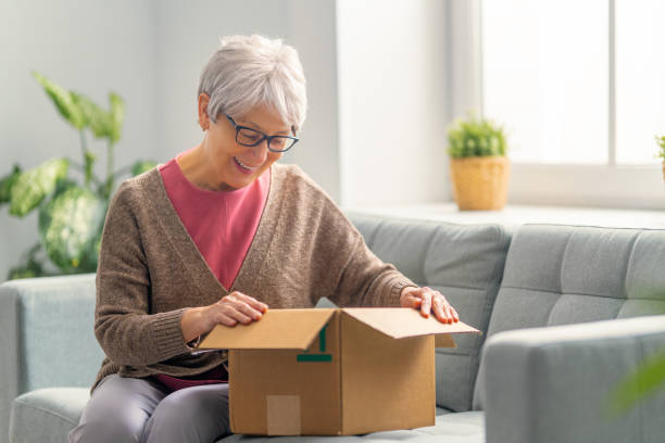 istock women are holding cardboard box 1306408736