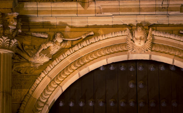 istock religious statue above a doorway on a church 1306408987