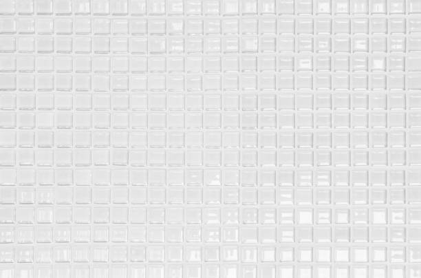 istock White or gray ceramic wall and floor tiles abstract background. Design geometric mosaic texture decoration of the bedroom. Simple seamless pattern for backdrop hospital wall, canteen and grid paper. 1306410290
