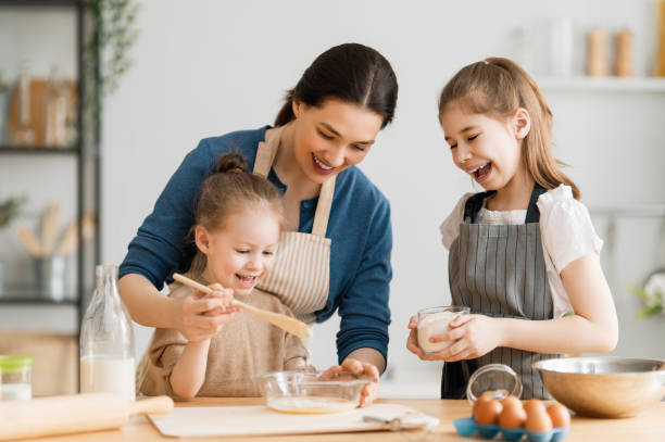 istock family are preparing bakery together 1306410447
