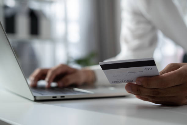 istock Man using credit card for online shopping 1306414495