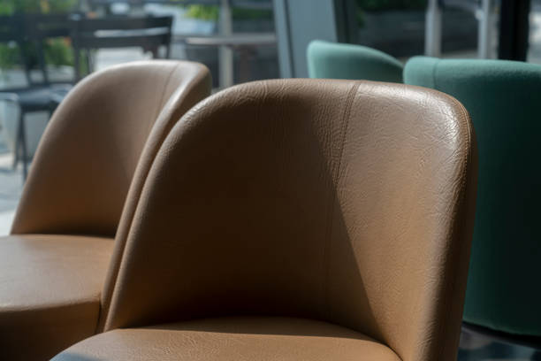 istock closeup armchair upholstery arrange setting in cafe restaurant with sun light from window side interior furniture design concept 1306416605
