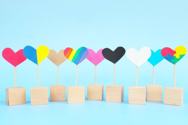Cultural, racial, gender, age and general equality, inclusion, love and diversity concept. Multicolored heart shape icons in blue background. Cultural, racial, gender, age and general equality, inclusion, love and diversity concept. Multicolored heart shape icons in blue background. multiculturalism stock pictures, royalty-free photos & images